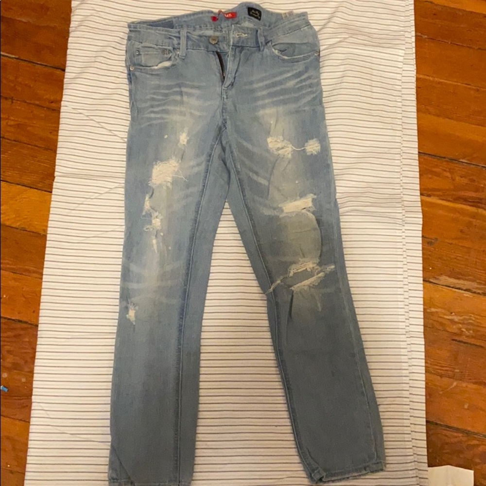 COPY - Ripped light wash jeans. Mid rise